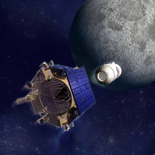 Shown is a colour illustration of a hexagonal blue object and a cylindrical white object above the Moon.