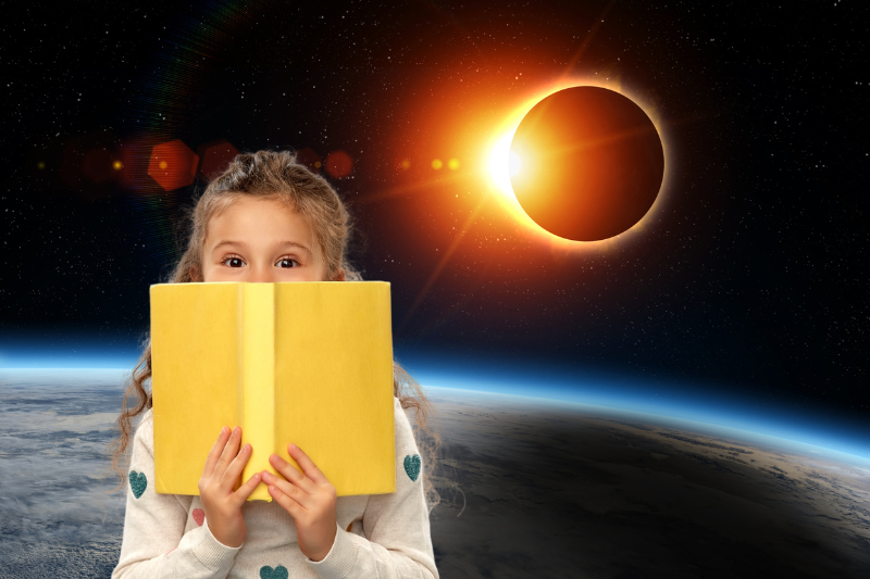 Child reading, solar eclipse
