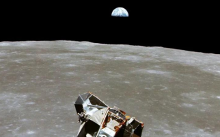 Lunar lander floating above the moon, with the Earth in the background