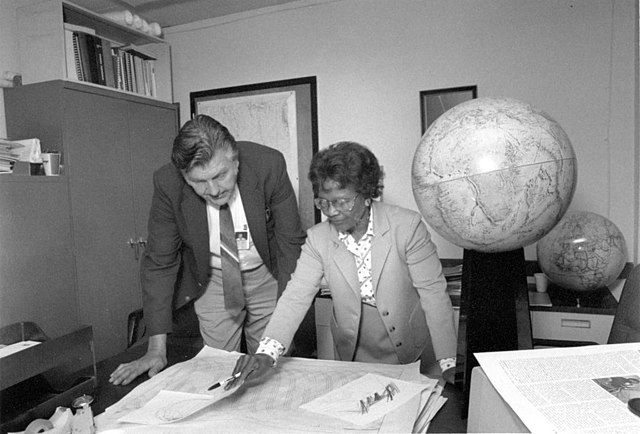 Gladys West and Sam Smith look over data from the Global Positioning System
