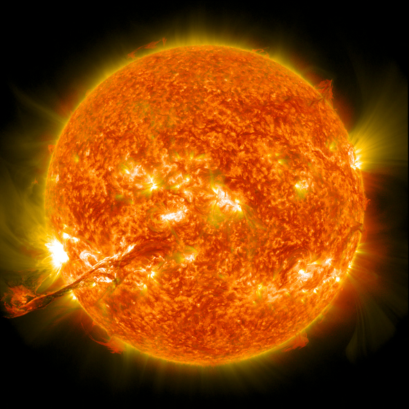 Shown is a colour photograph of a burst of bright yellow from the surface of the Sun.
