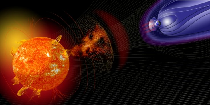 Shown is a colour illustration of wispy orange material blowing from the Sun toward Earth.