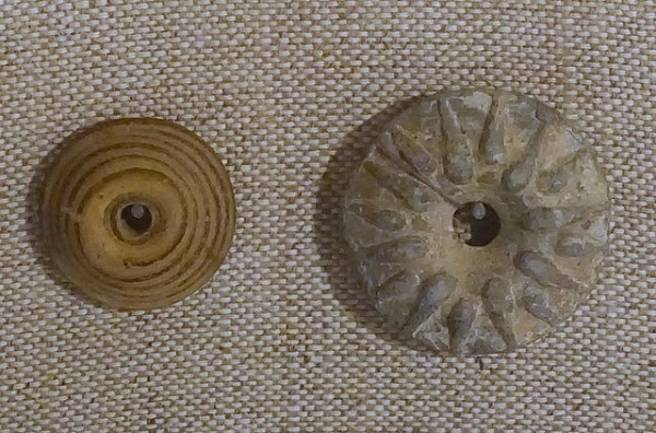 Ancient Roman buttons - glass on the left, lead on the right