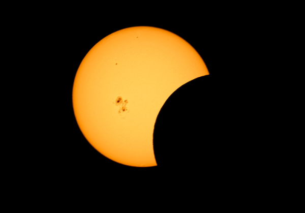 Shown is a colour photograph of the Sun against black space, with what looks like a large bite out of it.