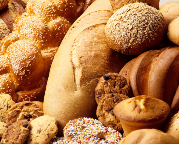 Shown is a colour photograph filled with breads, buns, muffins and cookies.